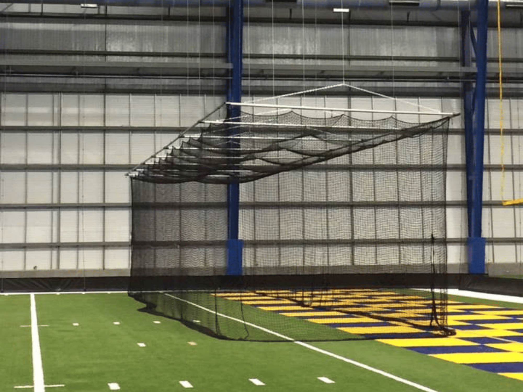 Indoor Batting Cage that is suspended from the ceiling