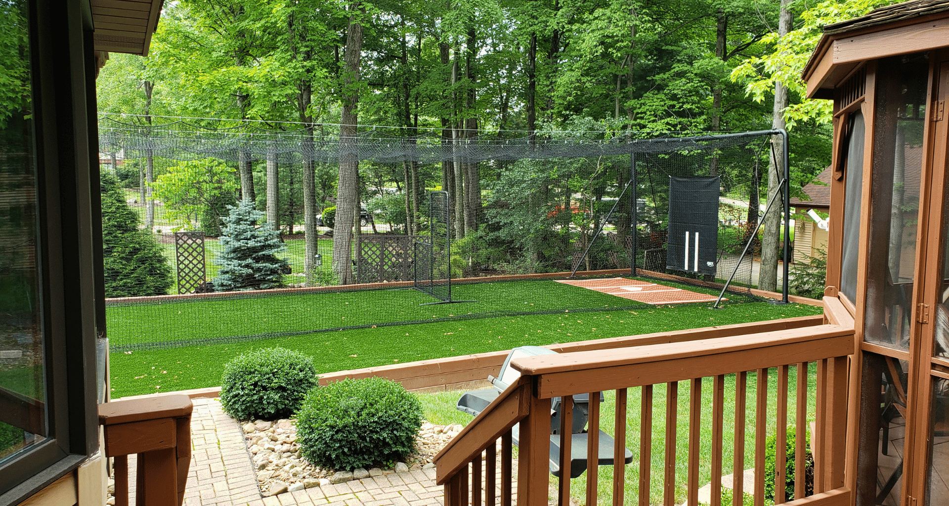 Iron Horse batting cage installed in persons backyard with turf