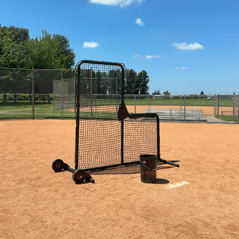 Armadillo L-Screen with wheels and ball bucket and baseball infield.