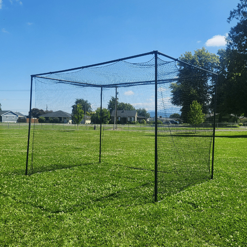 Full view of our BCI Portable Backstop with green grass and blue skys
