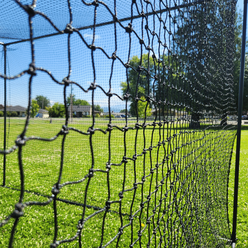 Close up of our BCI backstop netting with green outfield