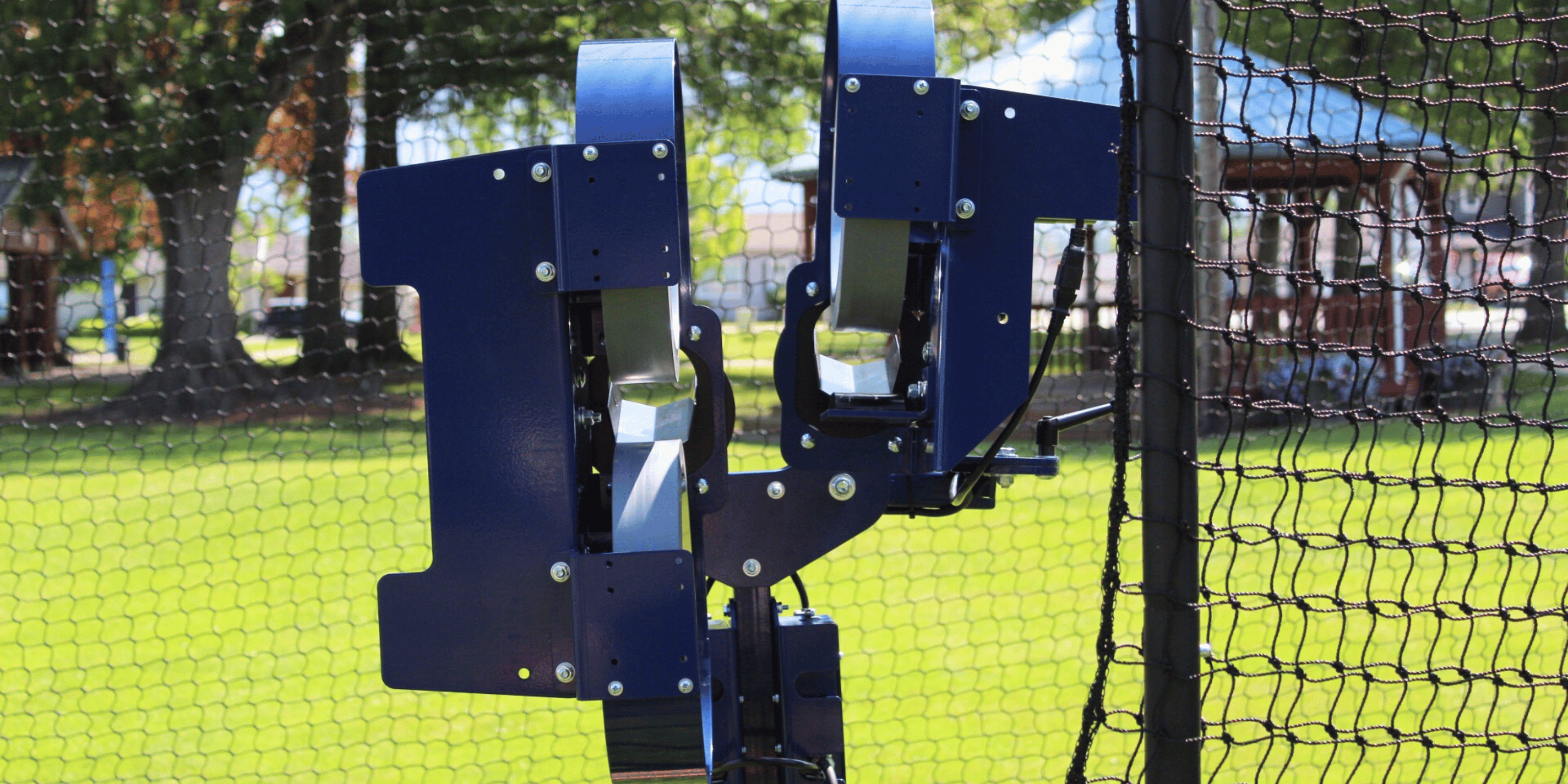 Bata 2 pitch 3 pitching machine in batting cage with screen