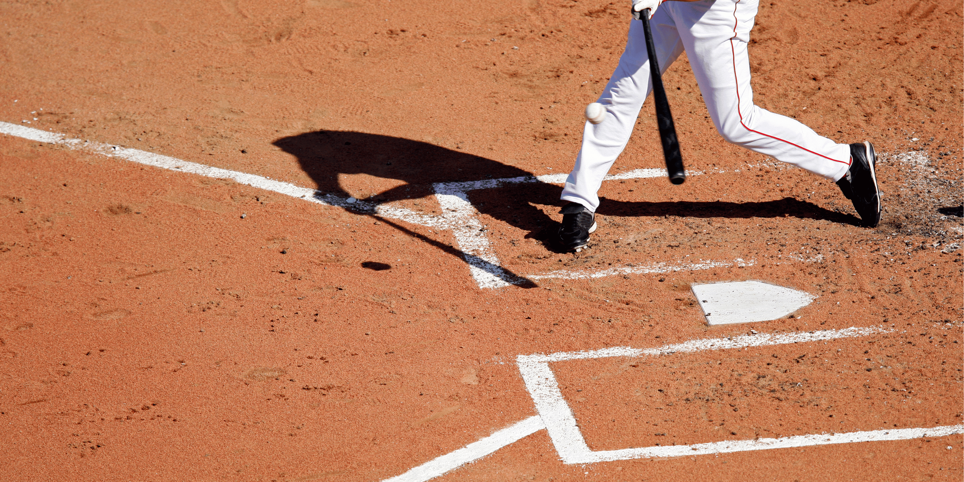 Man batting in baseball batters box