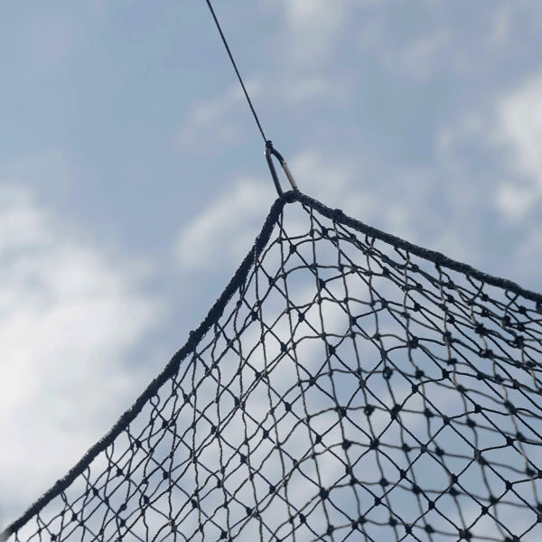 Batting cage netting clipped at the rope border