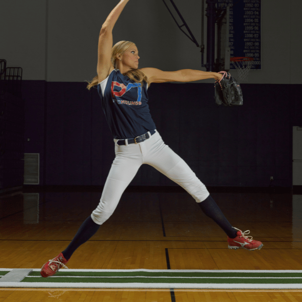 Fennie Finch using a softball pitching mat