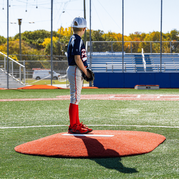 Boy getting ready to pitch a baseball on a pitching mound
