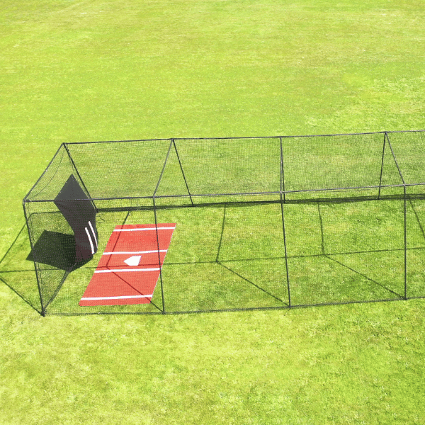 Trapezoid batting cage on top of green grass with a vinyl backdrop and mat inside