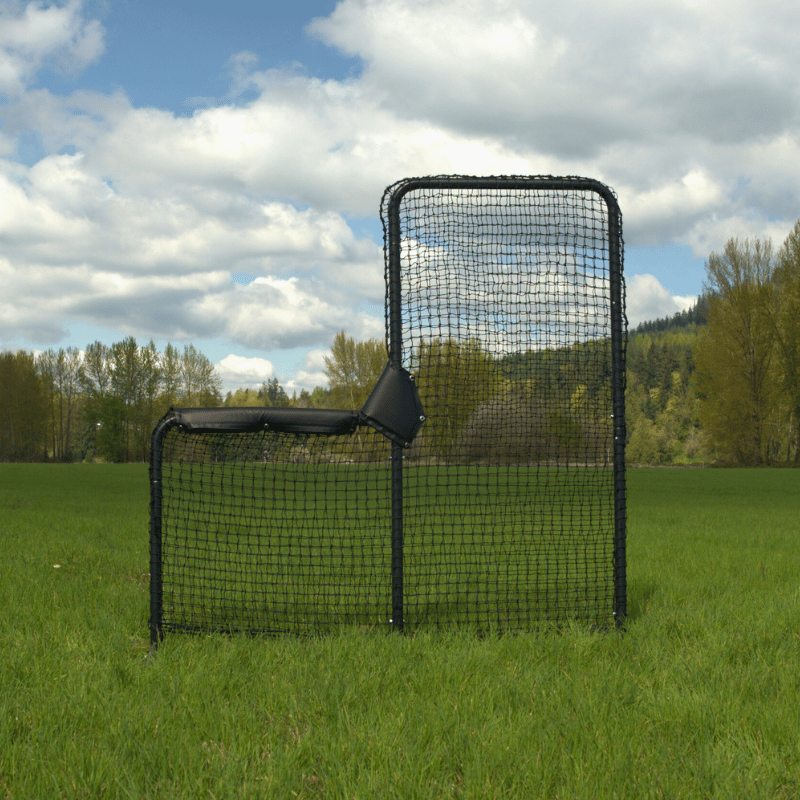 The Armadillo L-Screen on green grass with cloudy skys and trees behind