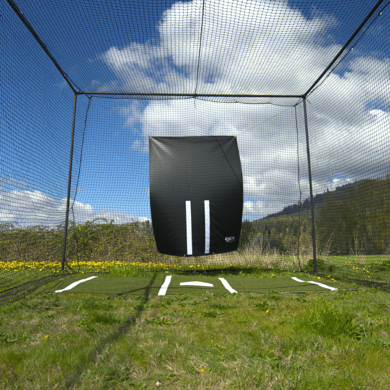 Vinyl backdrop hung inside the batting cage