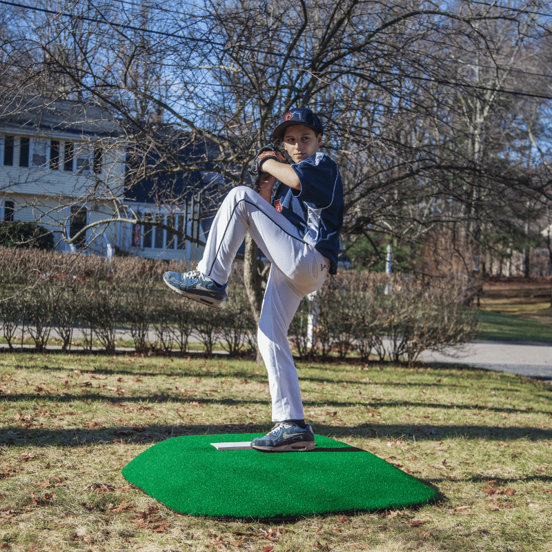 Boy pitching on ProMound 5070 Youth Game Mound Green