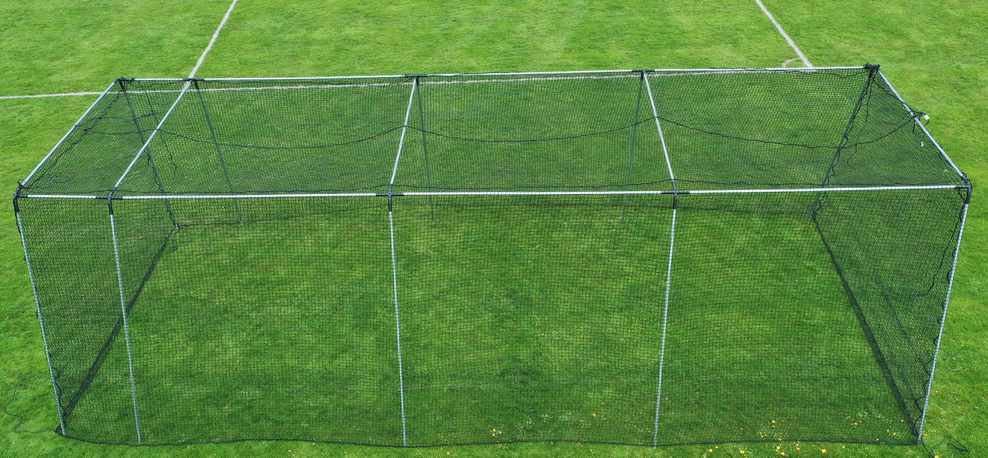 Freestanding Trapezoid Batting Cage on field grass