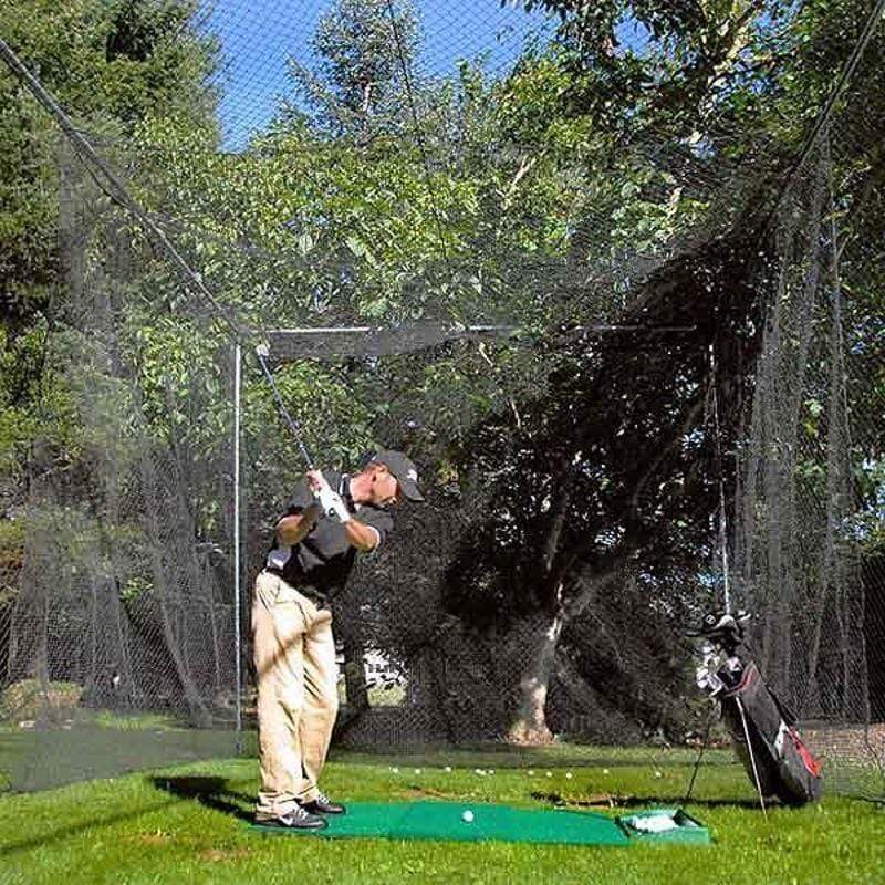 Man hitting golf balls into Batting Cage Golf Insert
