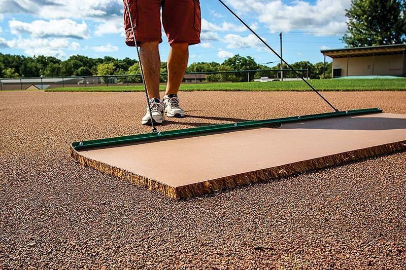 Man dragging 6X4 Cocoa Mat W/Level Bar