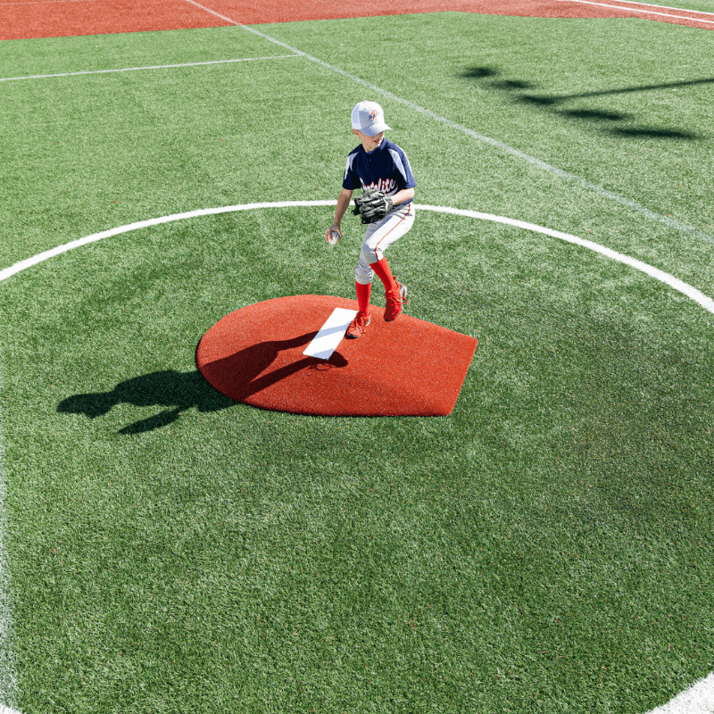 Boy pitching off of the Portolite 6in Stride Off Game Mound